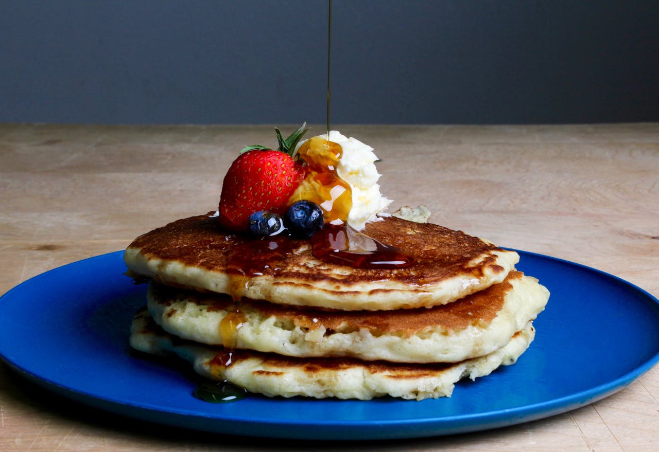 A photo of a short stack of pancakes. Photo by Sydney Troxell via Pexels